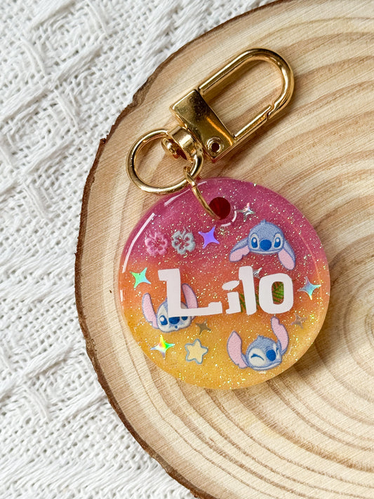Round sunset gradient resin pet tag with Lilo and Stitch theme design, personalized with pet's name and phone number for dogs and cats